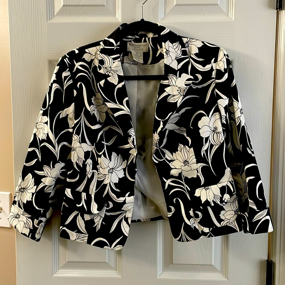 Floral print jacket, white flowers on black background.